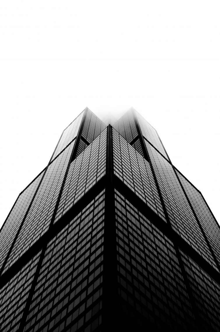 Image of a tall city building looking up from below