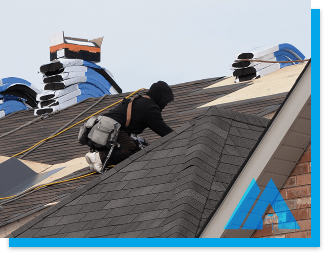A roofer tied to roof top working